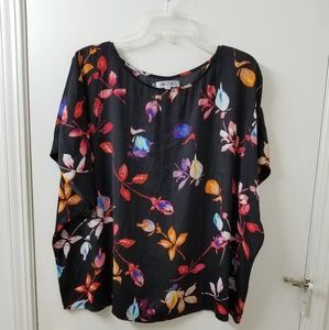 Jennifer Lopez black and floral blouse